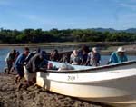 Roatan Islanders Pushing Boat